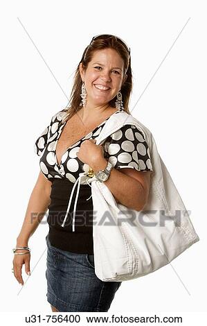 Stock Image - Girl in her late 30s in a studio setting smiling at the camera. Fotosearch