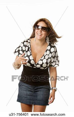 Girl in her late 30s wearing sunglasses in a studio setting smiling View Large Photo Image Stock Image - Girl in her late 30s wearing sunglasses in a studio setting smiling. Fotosearch