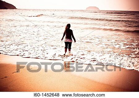 Girl in Laga beach, Biscay, Spain View Large Photo Image Stock Photo - Girl in Laga beach, Biscay, Spain. Fotosearch