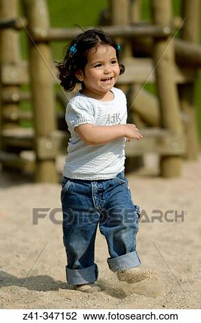 Stock Image - Girl in playground. Fotosearch