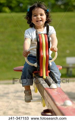 Girl in playground View Large Photo Image Stock Image - Girl in playground. Fotosearch