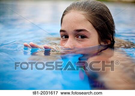 Girl in pool, out of the water, Marbella, Spain View Large Photo Image Stock Photo - Girl in pool, out of the water, Marbella, Spain. Fotosearch