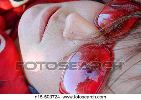 Picture - Girl in red sunglasses. Fotosearch