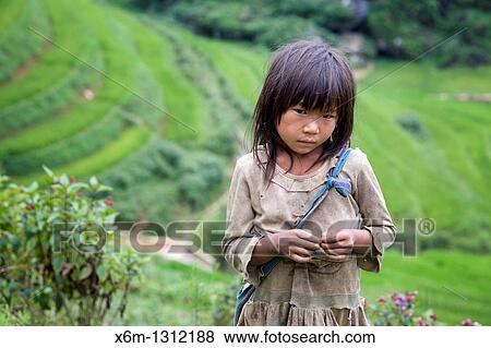 Stock Photo - girl in Sapa-Ta Phin treeking road Sapa, Lao Cai province, Vietnam. Fotosearch