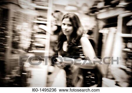 Girl in shop, Madrid, Spain View Large Photo Image Stock Photograph - Girl in shop, Madrid, Spain. Fotosearch