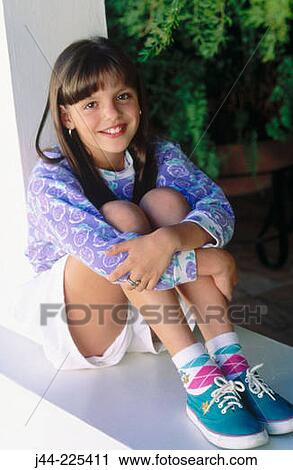 Girl in short pants smiling View Large Photo Image Stock Image - Girl in short pants smiling. Fotosearch
