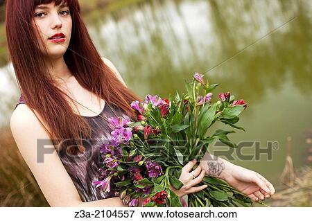 Girl in summerdress with bouqet of flowers and rose tattoo. View Large Photo Image Stock Photo - Girl in summerdress with bouqet of flowers and rose tattoo.. Fotosearch