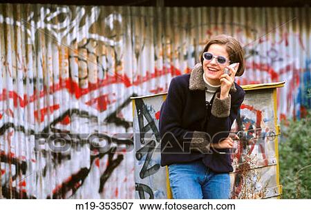 girl in sunglasses on a cellular View Large Photo Image Stock Photo - girl in sunglasses on a cellular. Fotosearch