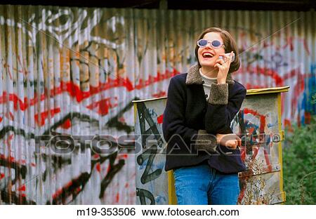 girl in sunglasses on a cellular View Large Photo Image Stock Photograph - girl in sunglasses on a cellular. Fotosearch