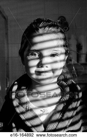 Girl in sunlit stripes View Large Photo Image Stock Image - Girl in sunlit stripes. Fotosearch