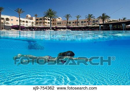 Girl in swimming pool in luxury hotel. View Large Photo Image Stock Image - Girl in swimming pool in luxury hotel.. Fotosearch