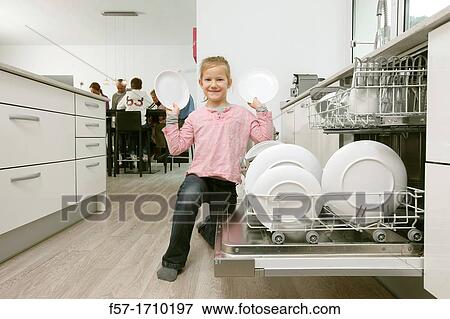 Girl in the kitchen View Large Photo Image Stock Photo - Girl in the kitchen. Fotosearch