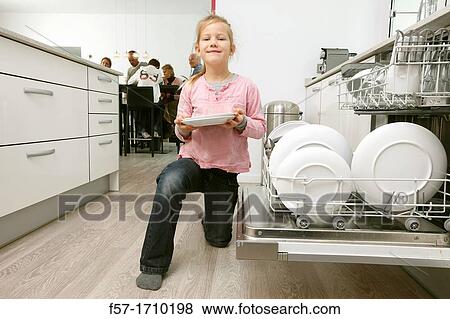 Girl in the kitchen View Large Photo Image Stock Photo - Girl in the kitchen. Fotosearch
