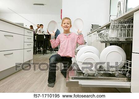 Stock Photography - Girl in the kitchen. Fotosearch