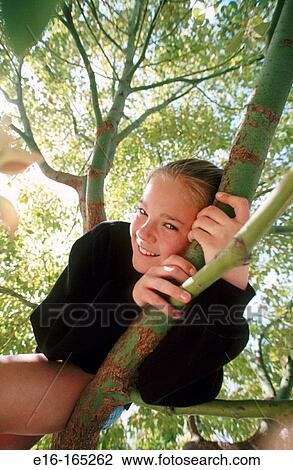 Girl in tree View Large Photo Image Stock Image - Girl in tree. Fotosearch