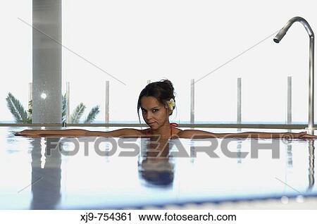 Stock Image - Girl in water in an SPA.. Fotosearch