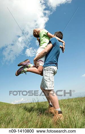 girl jumps on her boyfriend View Large Photo Image Stock Image - girl jumps on her boyfriend. Fotosearch