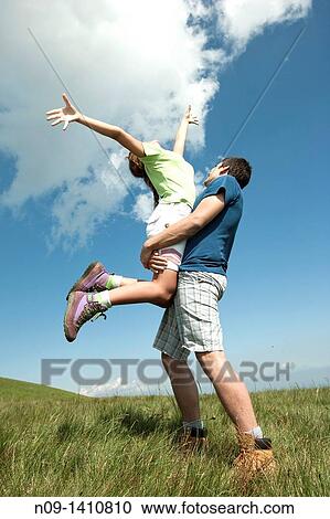 girl jumps on her boyfriend View Large Photo Image Stock Image - girl jumps on her boyfriend. Fotosearch