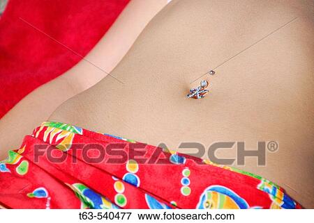 girl laying on beach with belly piercing of? k? View Large Photo Image Stock Photo - girl laying on beach with belly piercing of? k?. Fotosearch