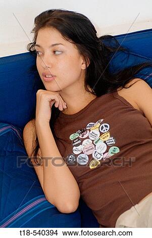 girl leaning and relaxing on couch View Large Photo Image Picture - girl leaning and relaxing on couch. Fotosearch