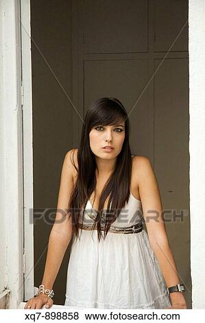 Girl leaning out of a window View Large Photo Image Stock Photo - Girl leaning out of a window. Fotosearch