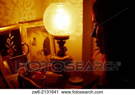 Girl looking at a picture frame View Large Photo Image Stock Image - Girl looking at a picture frame. Fotosearch