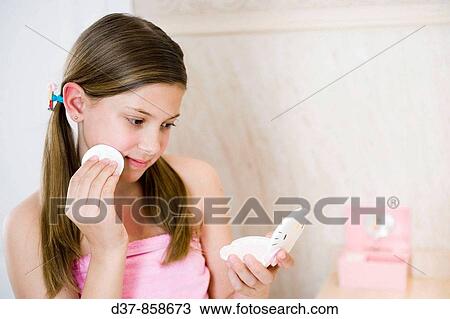 Girl looking herself in a mirror View Large Photo Image Stock Image - Girl looking herself in a mirror. Fotosearch