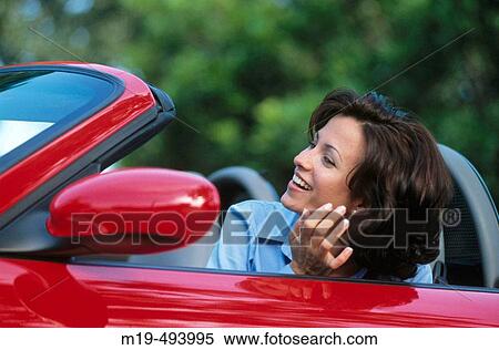 girl looking in a car mirror View Large Photo Image Stock Photography - girl looking in a car mirror. Fotosearch