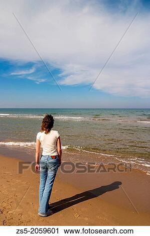 Girl looking the sea in a beach, Cullera, Comunidad Valenciana, Spain, Europe. View Large Photo Image Stock Image - Girl looking the sea in a beach, Cullera, Comunidad Valenciana, Spain, Europe.. Fotosearch