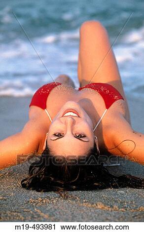 girl lying on the beach View Large Photo Image Stock Image - girl lying on the beach. Fotosearch