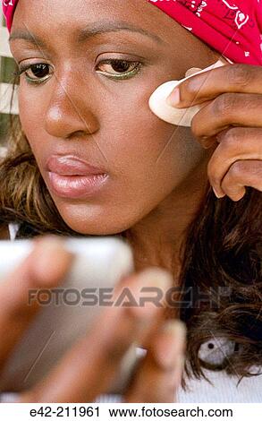 Girl making up her eyes View Large Photo Image Stock Image - Girl making up her eyes. Fotosearch