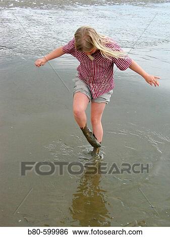 Girl, mudbath. Sankt Peter-Ording, Germany View Large Photo Image Stock Photograph - Girl, mudbath. Sankt Peter-Ording, Germany. Fotosearch