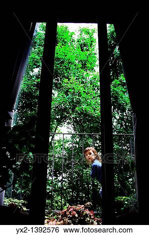Girl on a balcony overlooking country house View Large Photo Image Stock Photograph - Girl on a balcony overlooking country house. Fotosearch