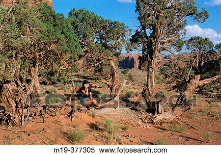 girl on a cell phone in Monument Valley usa View Large Photo Image Stock Photography - girl on a cell phone in Monument Valley usa. Fotosearch