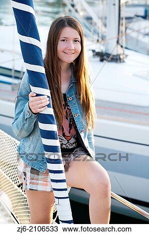 Girl on a sailboat. View Large Photo Image Stock Image - Girl on a sailboat.. Fotosearch
