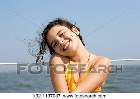 Stock Photo - Girl on a sailboat. Fotosearch