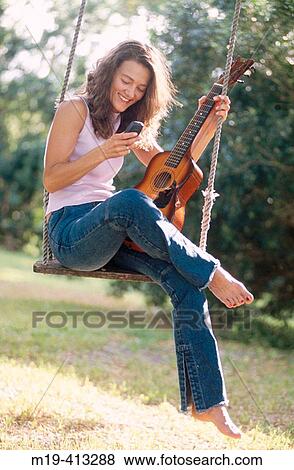 Stock Photo - girl on a swing. Fotosearch