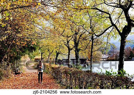 Girl on a walk by the Wolfgang lake, Austria. View Large Photo Image Stock Photograph - Girl on a walk by the Wolfgang lake, Austria.. Fotosearch