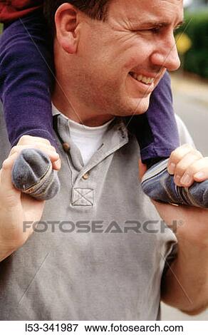 Girl on dad's shoulders. View Large Photo Image Stock Photo - Girl on dad's shoulders.. Fotosearch