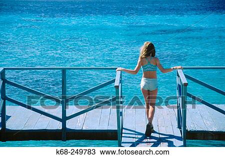 Girl on dock View Large Photo Image Stock Image - Girl on dock. Fotosearch