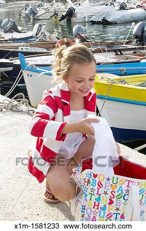 Girl on dock View Large Photo Image Stock Image - Girl on dock. Fotosearch