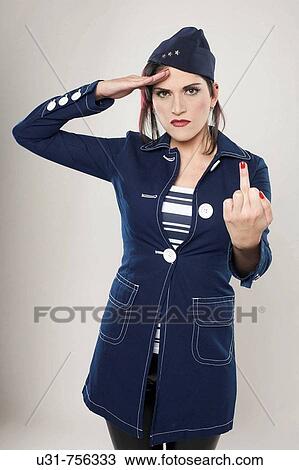 Girl on military outfit doing a salute showing her finger View Large Photo Image Stock Image - Girl on military outfit doing a salute showing her finger. Fotosearch