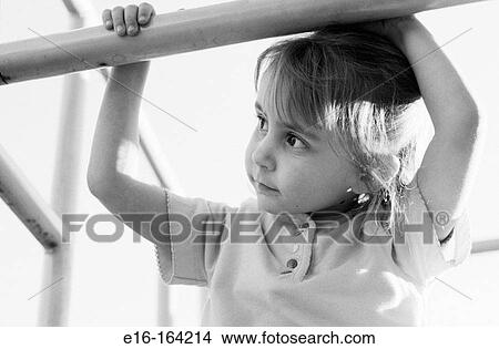 Girl on playground bars View Large Photo Image Picture - Girl on playground bars. Fotosearch