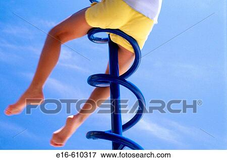 Girl on playground bars View Large Photo Image Stock Photo - Girl on playground bars. Fotosearch