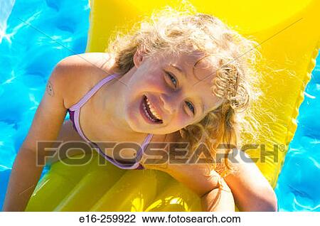 Stock Image - girl on raft. Fotosearch