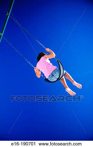 Stock Image - Girl on swing. Fotosearch
