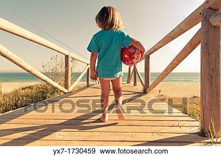 Stock Photo - Girl on the beach. Fotosearch