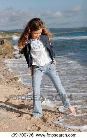 Stock Photograph - Girl on the beach, Tarifa. Cadiz province, Andalusia, Spain. Fotosearch