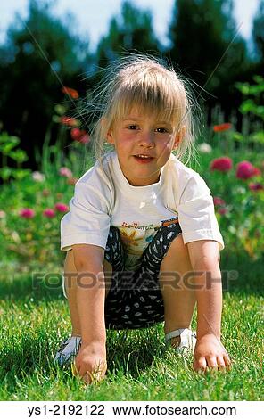 Girl on the Grass. View Large Photo Image Stock Image - Girl on the Grass.. Fotosearch