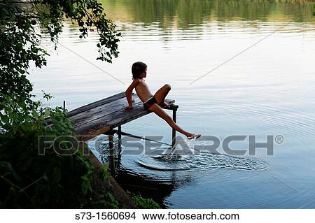 Girl on the pier in Lake Avral, Kirillovka, Samara Region, Russian Federation View Large Photo Image Picture - Girl on the pier in Lake Avral, Kirillovka, Samara Region, Russian Federation. Fotosearch